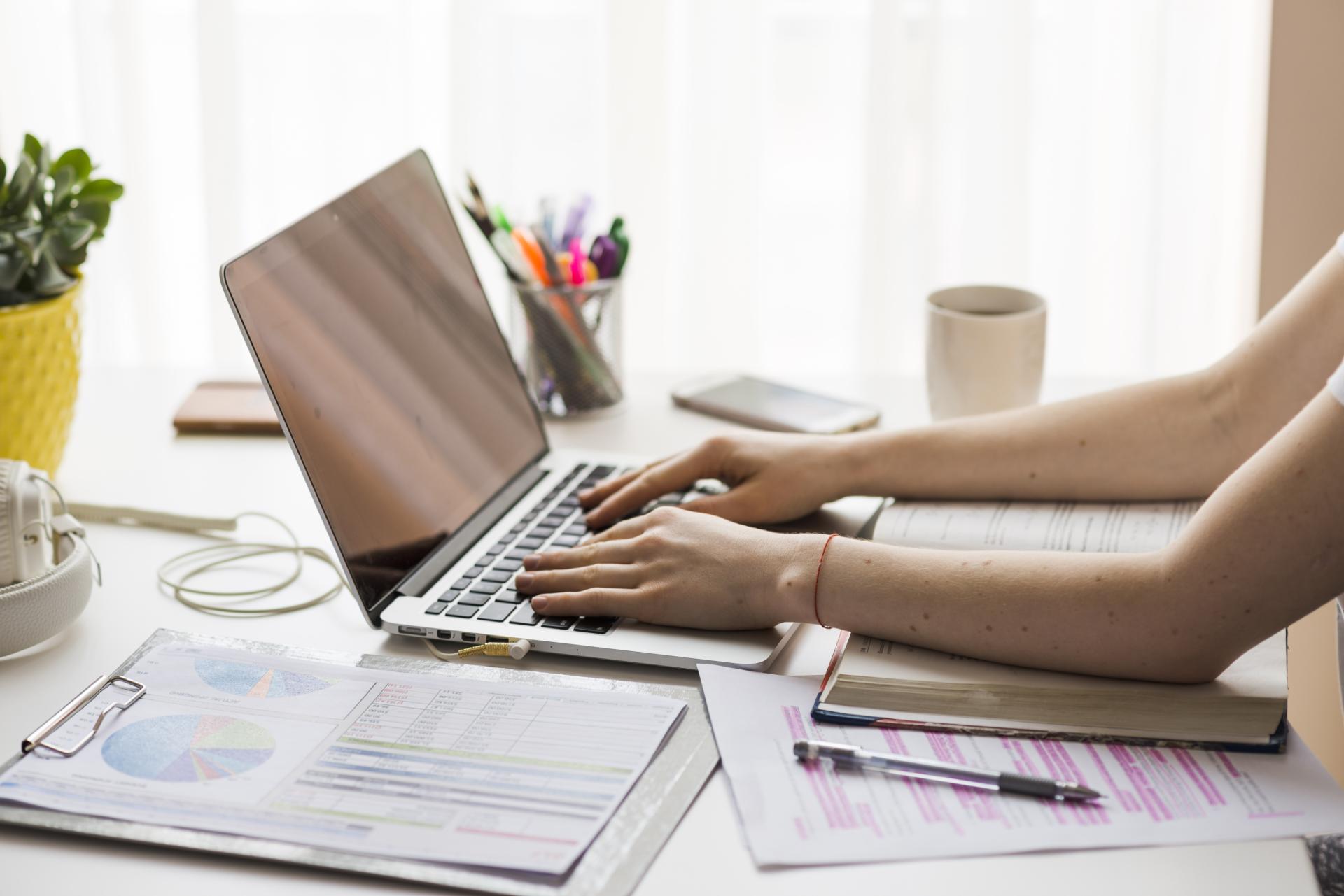 Crop hands using laptop office